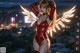 A woman in a red bodysuit with angel wings standing on top of a building.